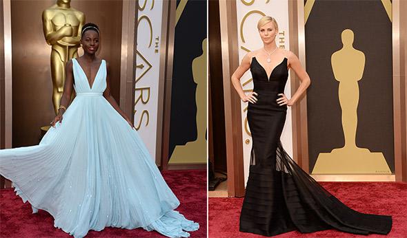 Lupita Nyong'o and Charlize Theron at the 86th Academy Awards on March 2nd, 2014 in Hollywood, California.