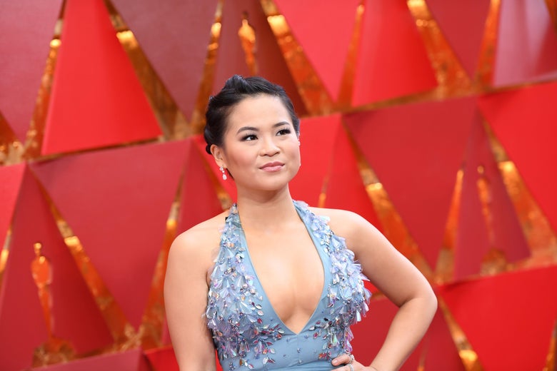 Kelly Marie Tran wears a blue bejeweled dress on the red carpet.