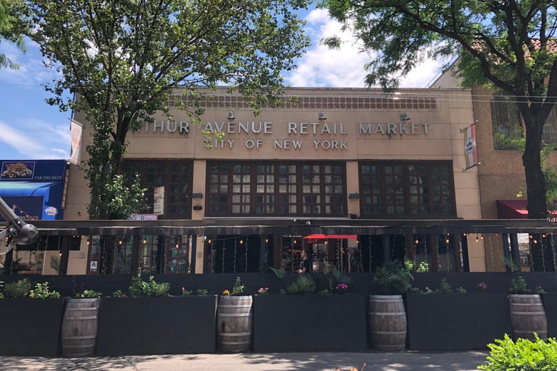 An open dining shed outside Arthur Avenue Retail Market in the Bronx's Little Italy.