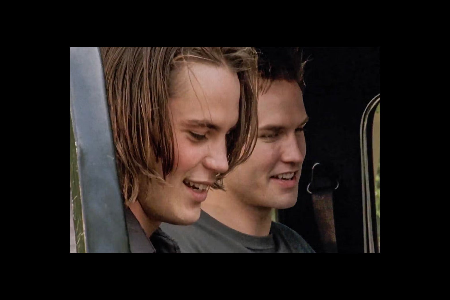 Tim Riggins and Jason Street smile at each other as they have a good time. 
