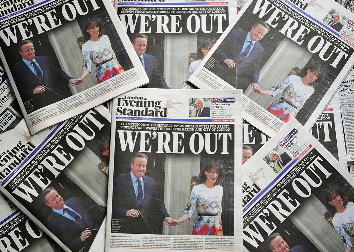 An arrangement of newspapers pictured in London on June 24, 2016 shows the front page of the London Evening Standard newpaper reporting the resignation of British Prime Minister David Cameron following the result of the UK's vote to leave the EU in the June 23 referendum.