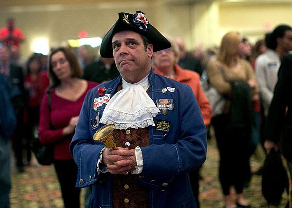 Tea Party member John Wallmeyer watches results from the Virginia Governor's race at an election night gathering of supporters of Republican candidate Virginia Attorney General Ken Cuccinelli.