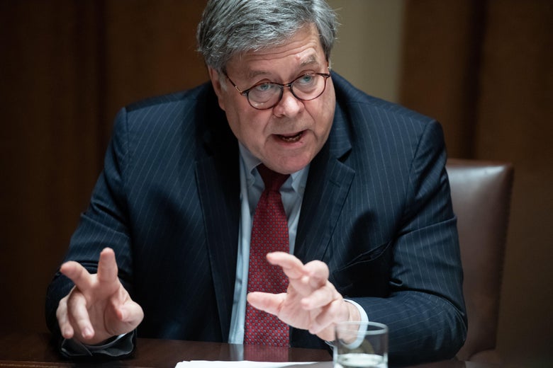 William Barr making "finger quotes" with his hands while sitting at a table.