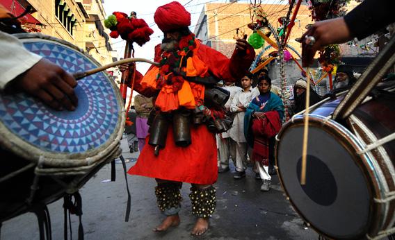A Pakistani devotee dances outside the shrine of Sufi Saint Data Ganj Bakhsh in Lahore.