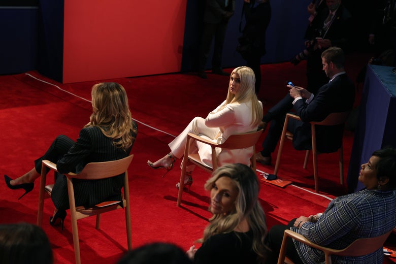 Trump guests including Ivanka, who turns to look at the camera, sit in socially distanced chairs on a red carpet. No one is wearing a mask.