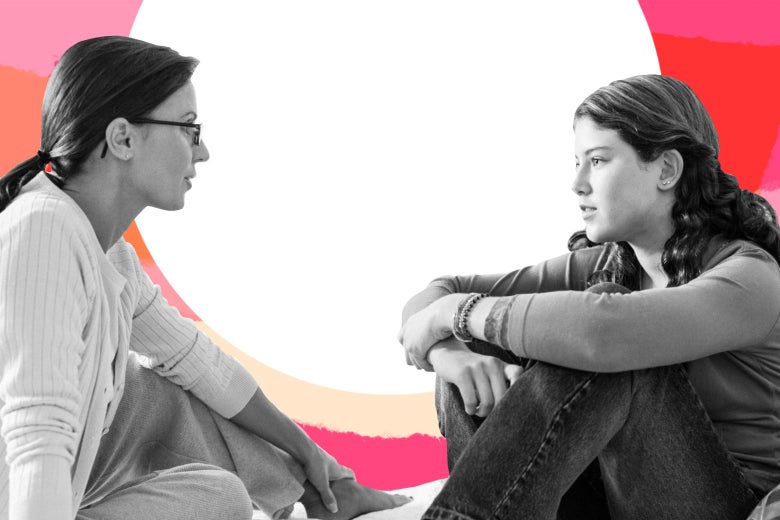 A woman sits down in conversation with a preteen girl.