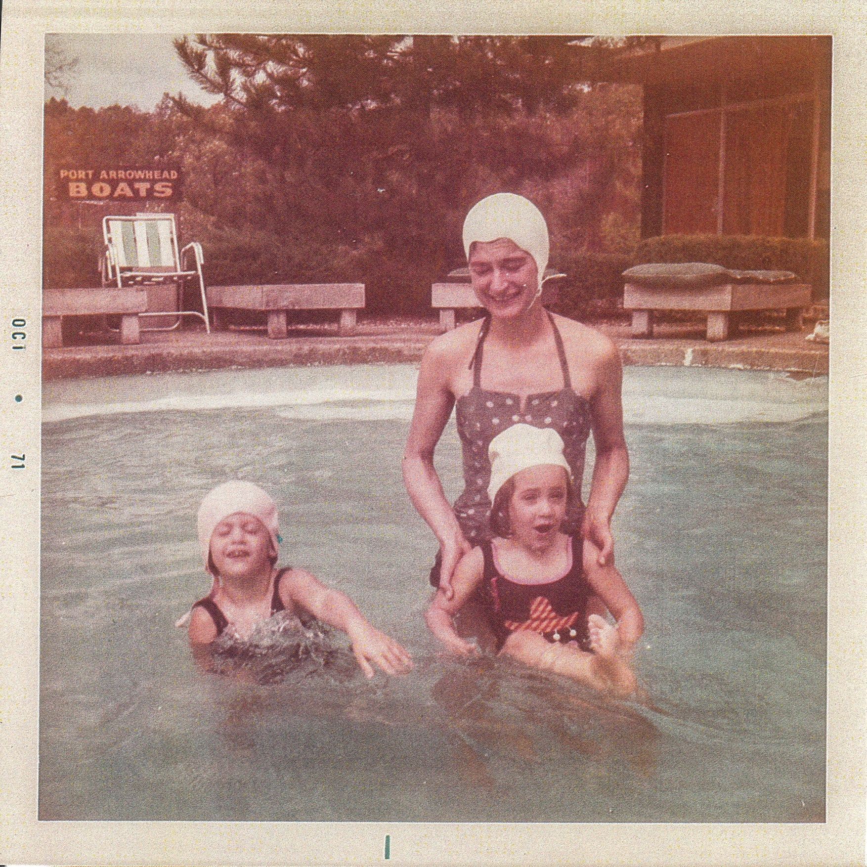 Alice Vogel Stroh in a pool with two children.