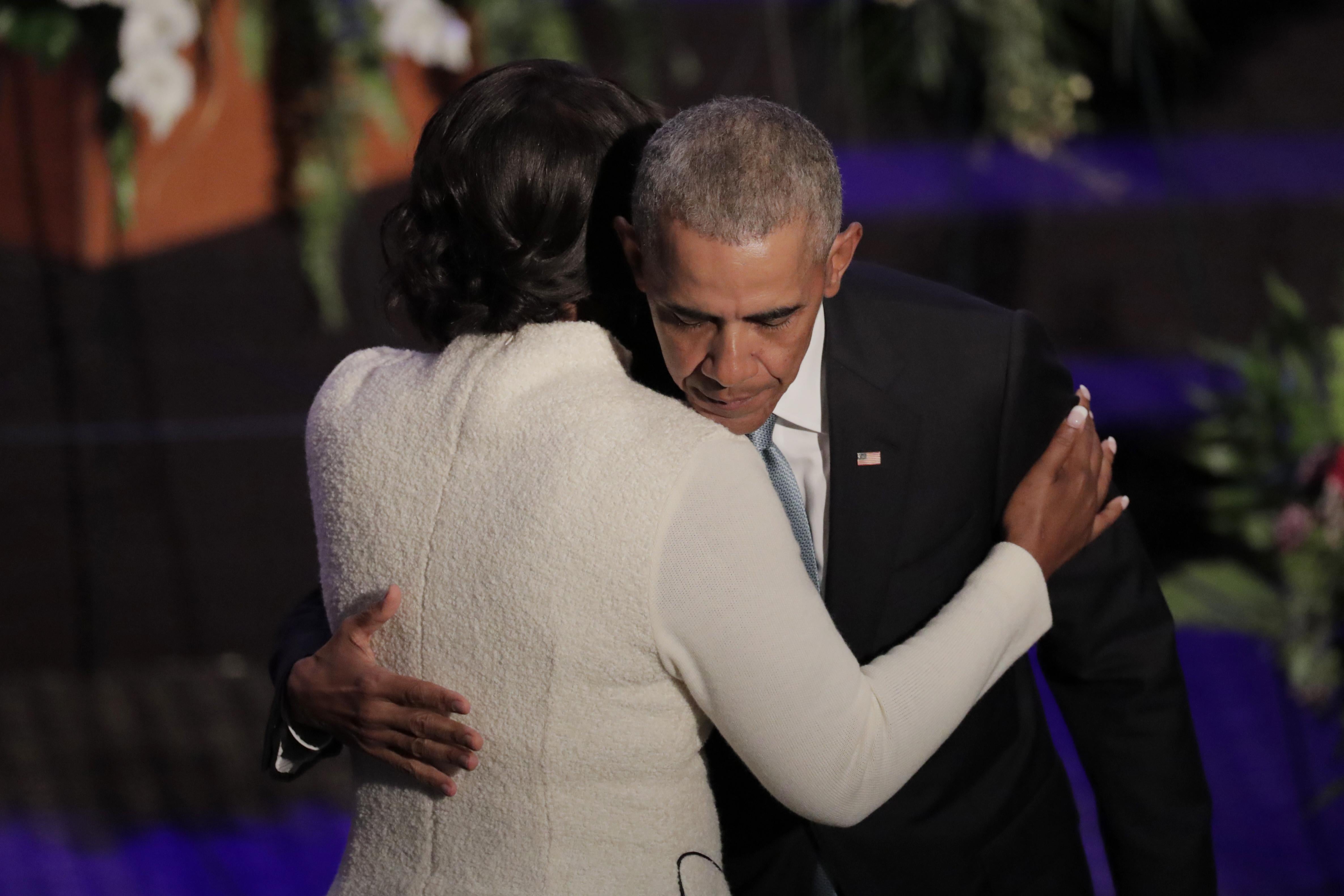 Former President Barack Obama hugs Maya Rockeymoore Cummings while onstage during funeral services for late Rep. Elijah Cummings.