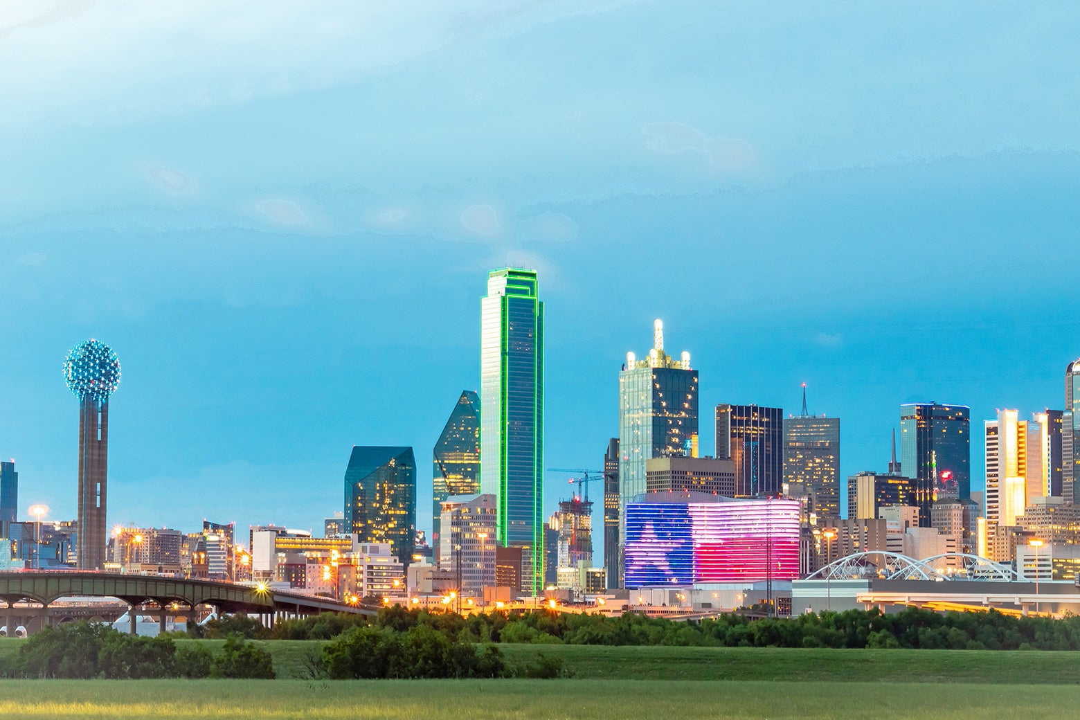 Illuminated colorful downtown buildings in the Dallas city skyline.