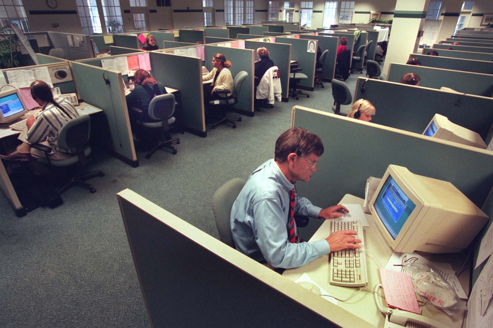 A cubicle farm of telemarketers at work.