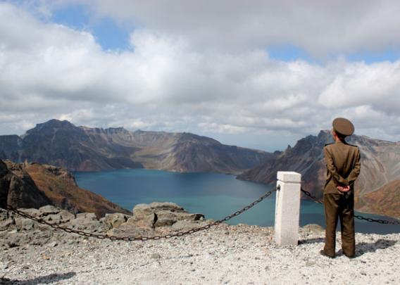 Soldier on Mount Paektu North Korea overlooking Lake Chon.