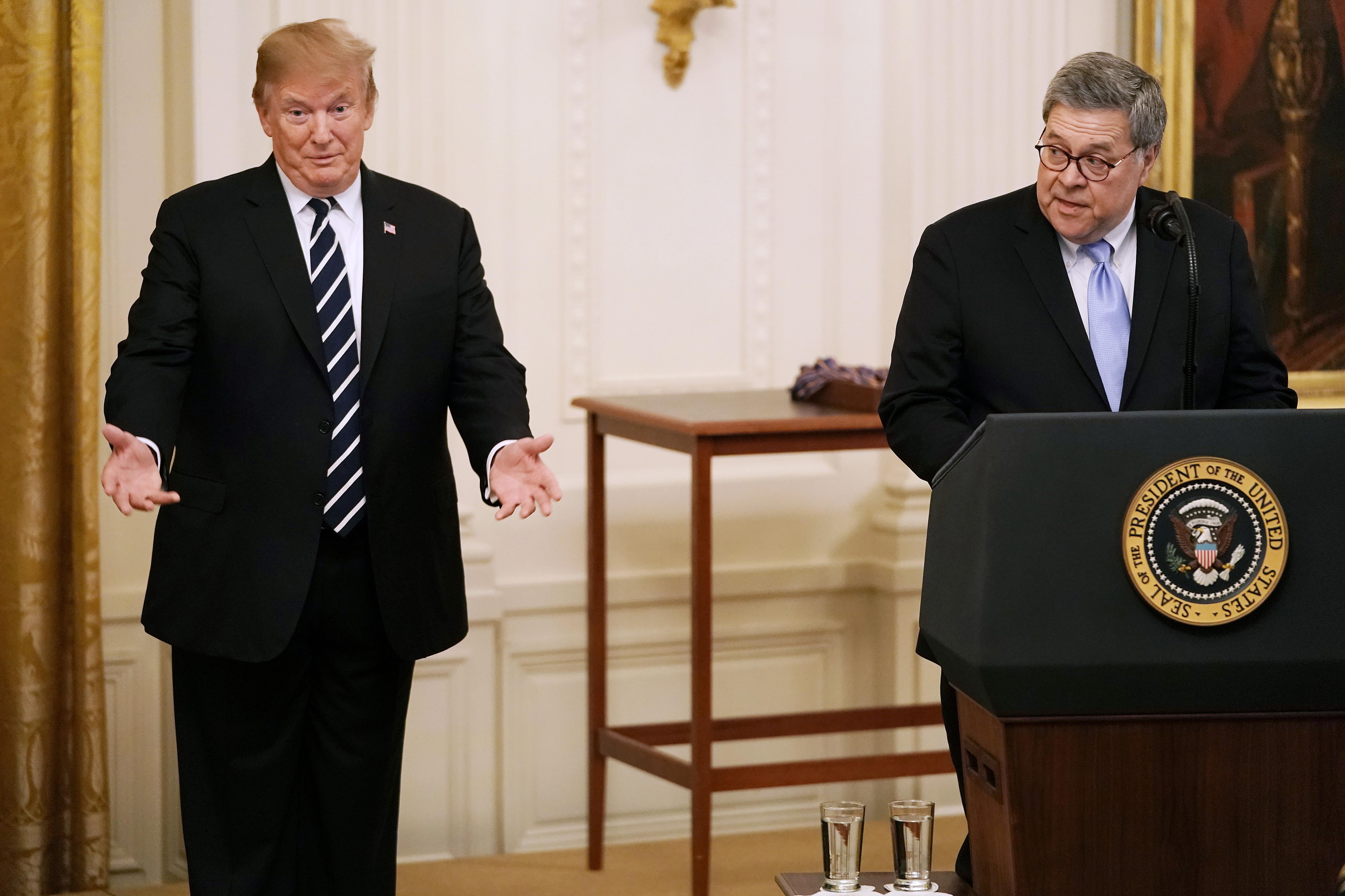 President Donald Trump listens to Attorney General William Barr during a ceremony in the East Room of the White House May 22, 2019 in Washington, D.C. 