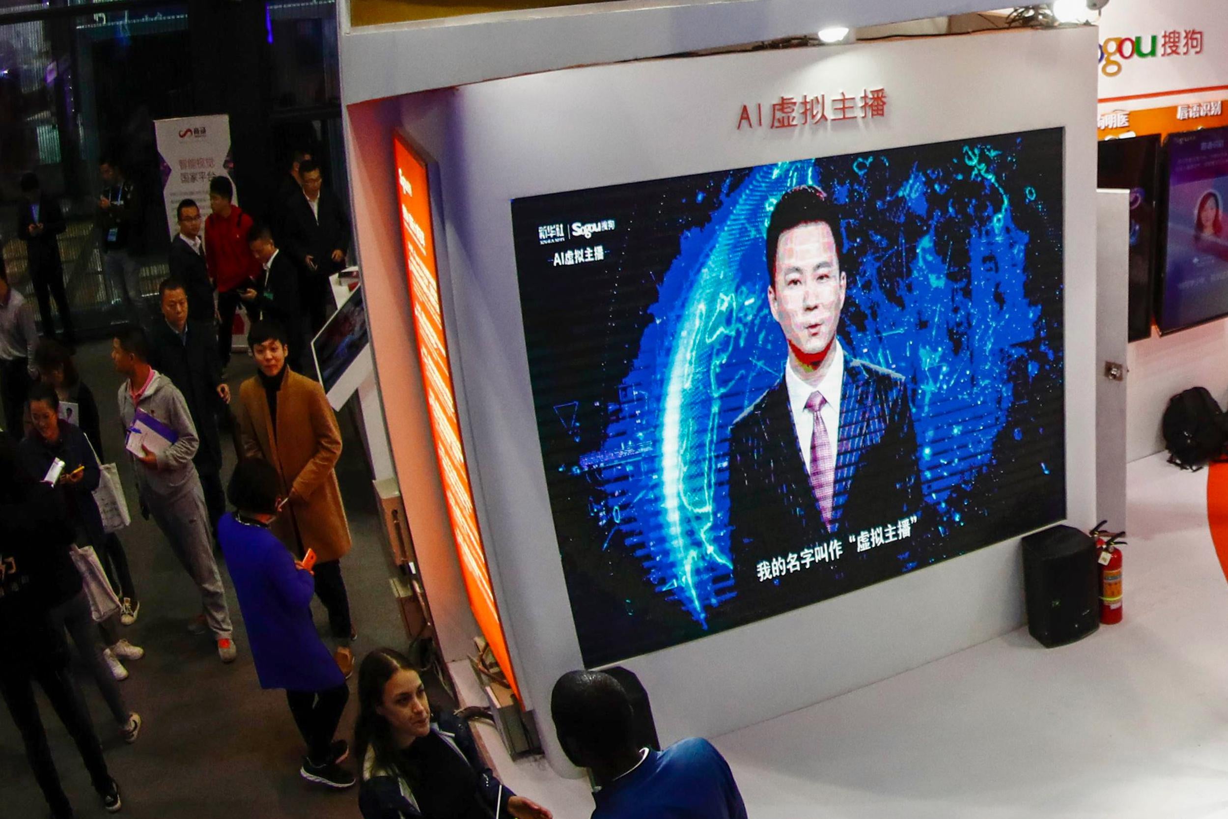 A screen shows an artificial intelligence news anchor introducing himself at the Light of Internet Expo during the 5th World Internet Conference in Wuzhen in China's eastern Zhejiang province.