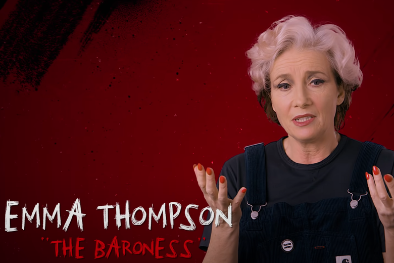emma thompson in a behind-the-scenes video, wearing a half-black, half-white wig