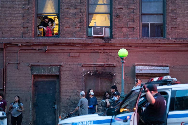 People from the community watch the NYPD arrest protesters for breaking the citywide 8:00PM curfew on June 4, 2020 in the Bronx borough of New York City. Widespread protests continue around the country and other parts of the world over the death of George Floyd while in Minneapolis, Minnesota police custody on May 25. (Photo by David Dee Delgado/Getty Images)