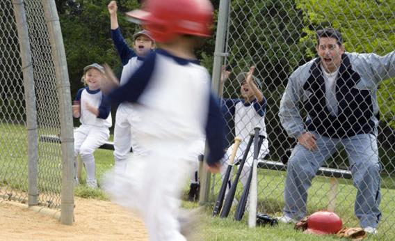 little boy playing baseball