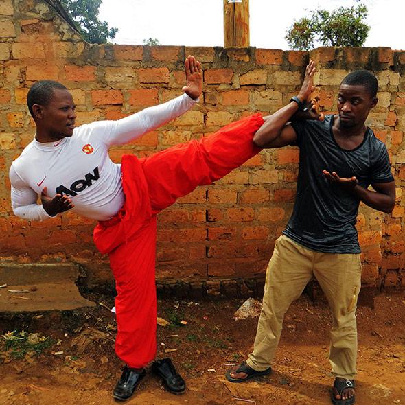Ugandan martial artists, brothers Kuraisn Baale and Muhammad Khassim Jumba, in Katwe slum, Kampala. Primary story characters. Favourite photo. Photo by: Elizabeth McSheffrey