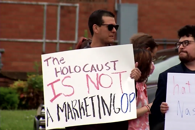 Protesters stand outside hatWRKS in Nashville on May 29, 2021 in this screenshot from a WZTV news report.