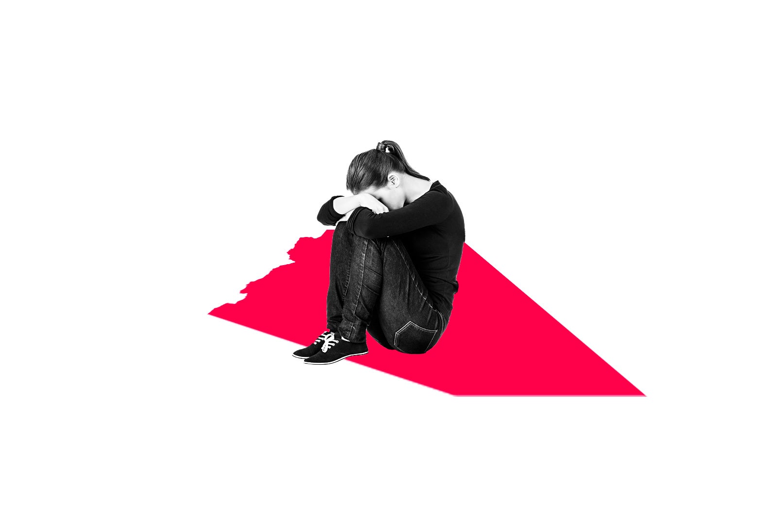 Woman with her head on her knees.