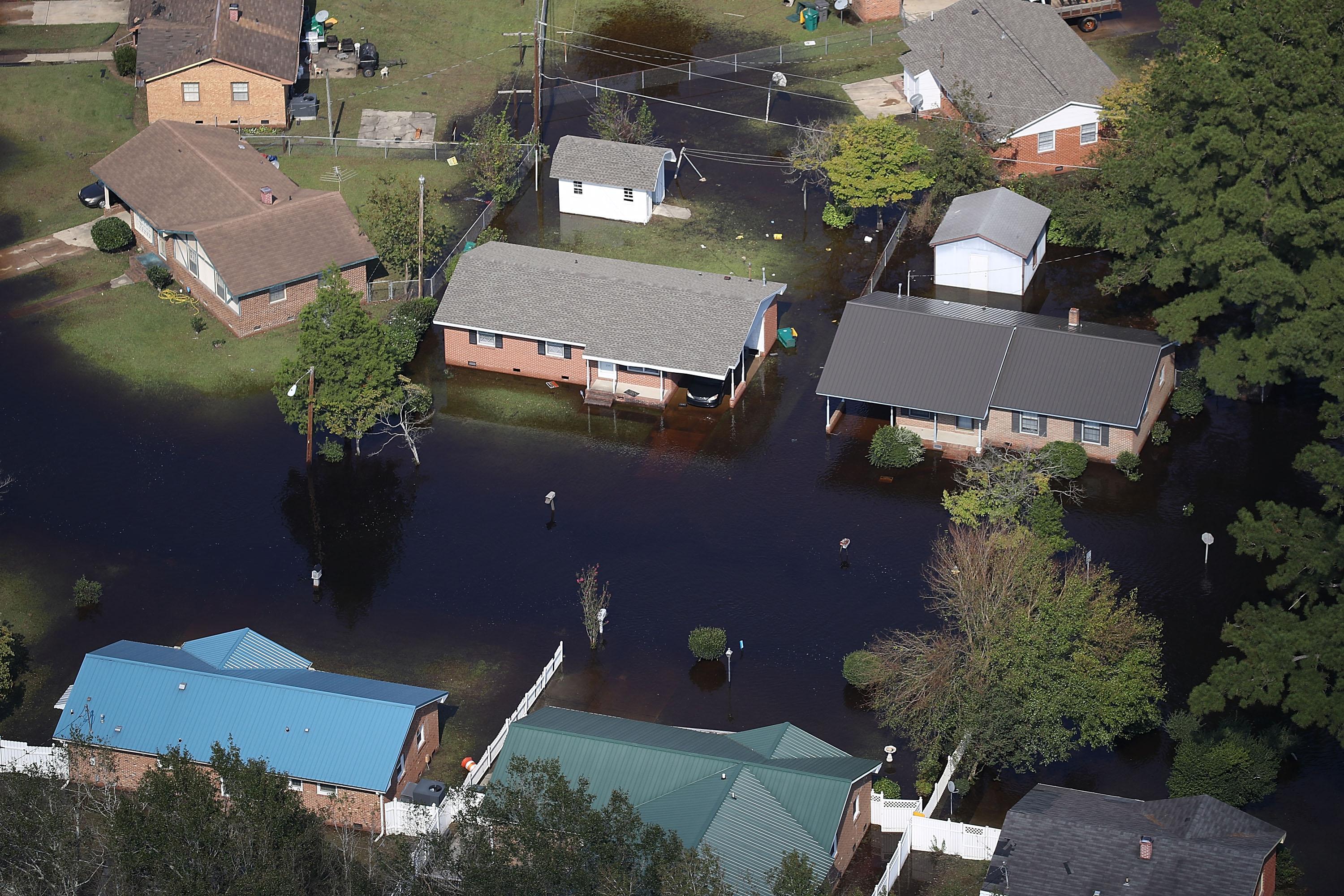 An aerial shot of flood waters surrounding family homes homes in the aftermath of Hurricane Florence. 