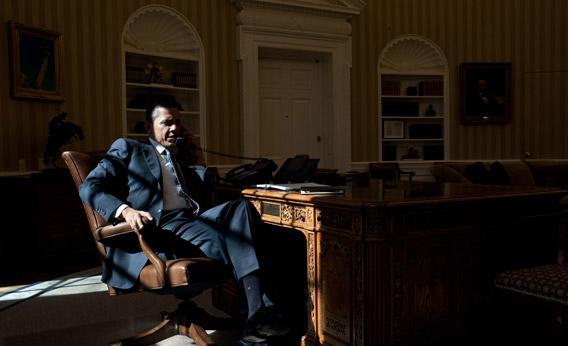 President Barack Obama talks on the phone in the Oval Office, Feb. 13, 2012