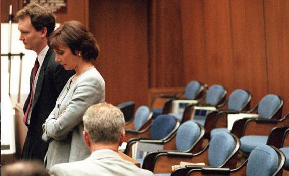 Prosecutors Hank Goldberg (L) and Marcia Clark (R) stand next to the empty jury box