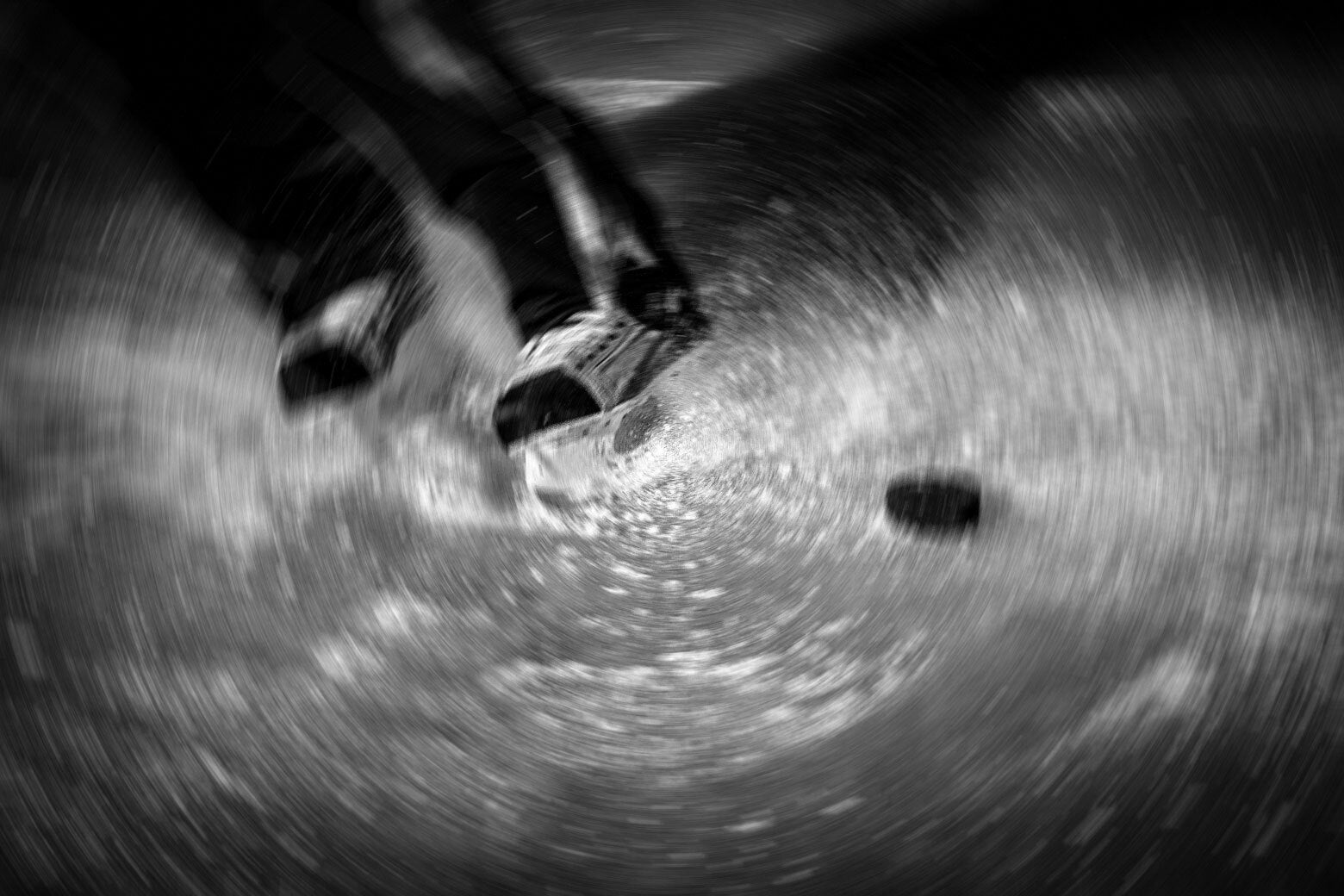 A blurred swirl of a man in a hockey game. 