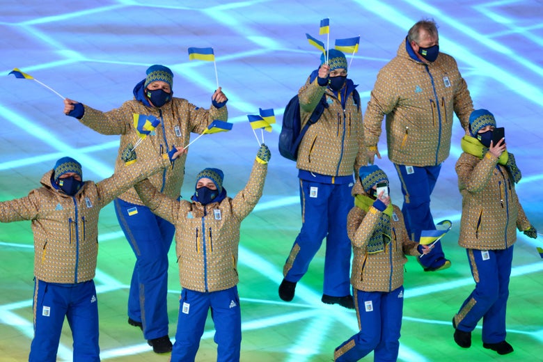 Team Ukraine athletes walk in a group.