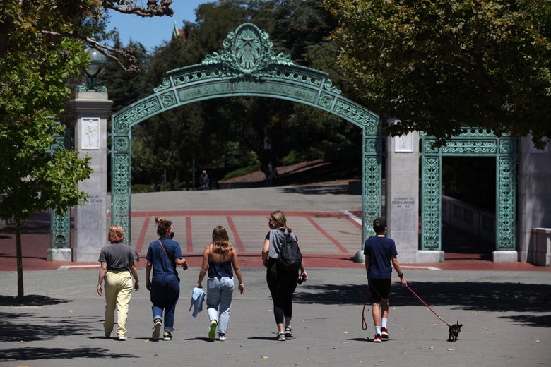 People walk towards Sather Gate on the U.C. Berkeley campus on July 22, 2020 in Berkeley, California.