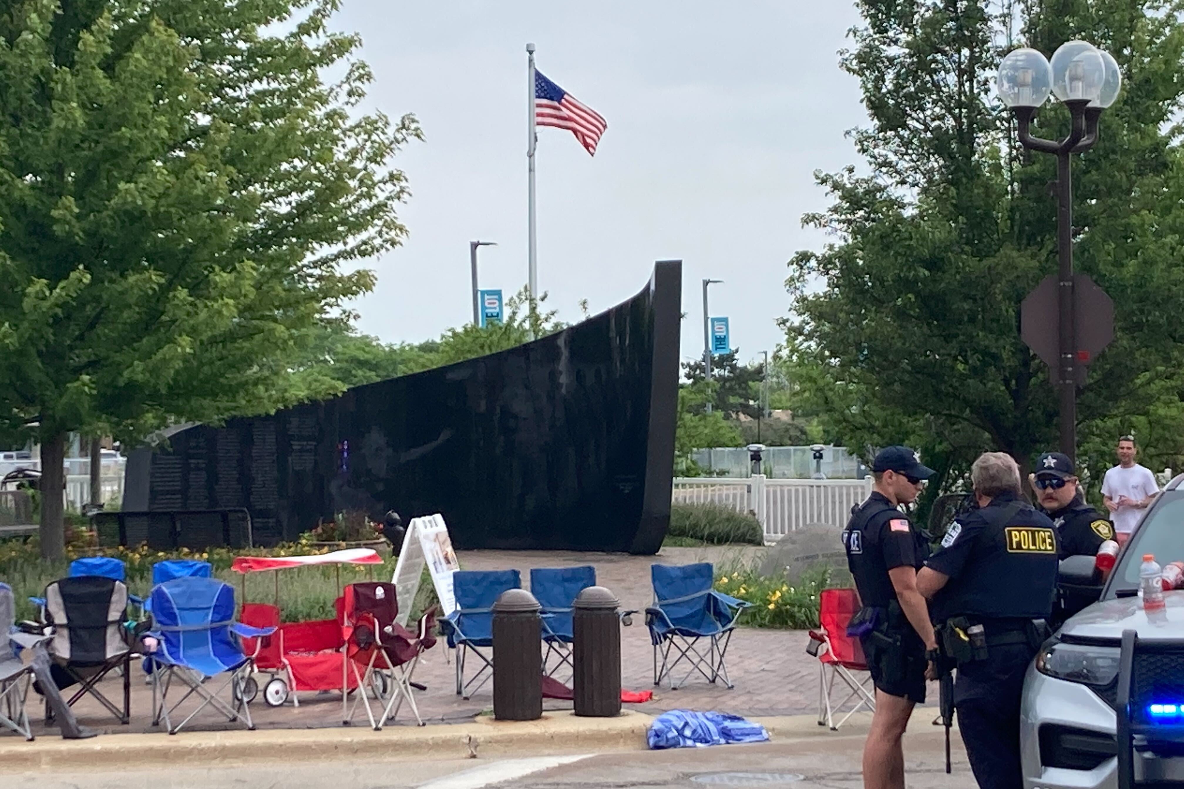 More abandoned chairs, and a veterans memorials, and police officers gathering.