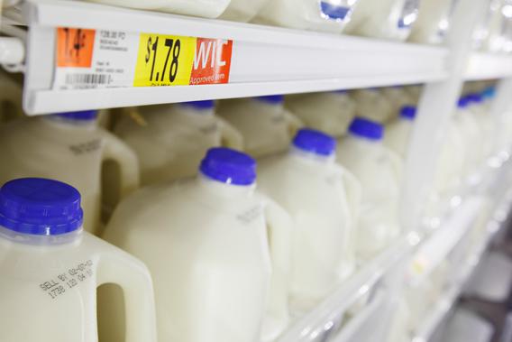 Gallons of milk in the dairy products section can be seen on display at a new Wal-Mart store in Chicago, January 24, 2012.