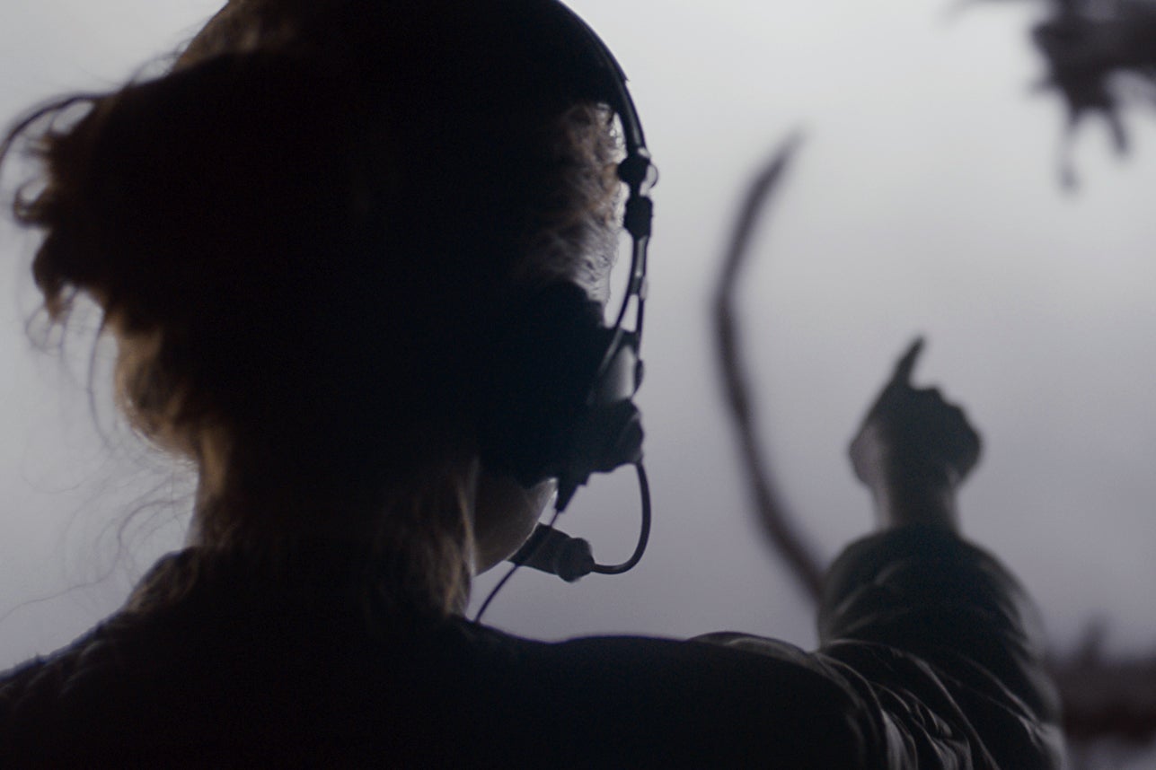 Woman pointing at an alien.