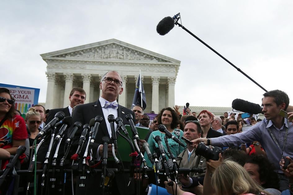 Jim Obergefell swarmed by press in front of the Supreme Court building.