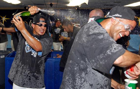 Tampa Bay Rays pitcher Joel Peralta celebrates with Champagne