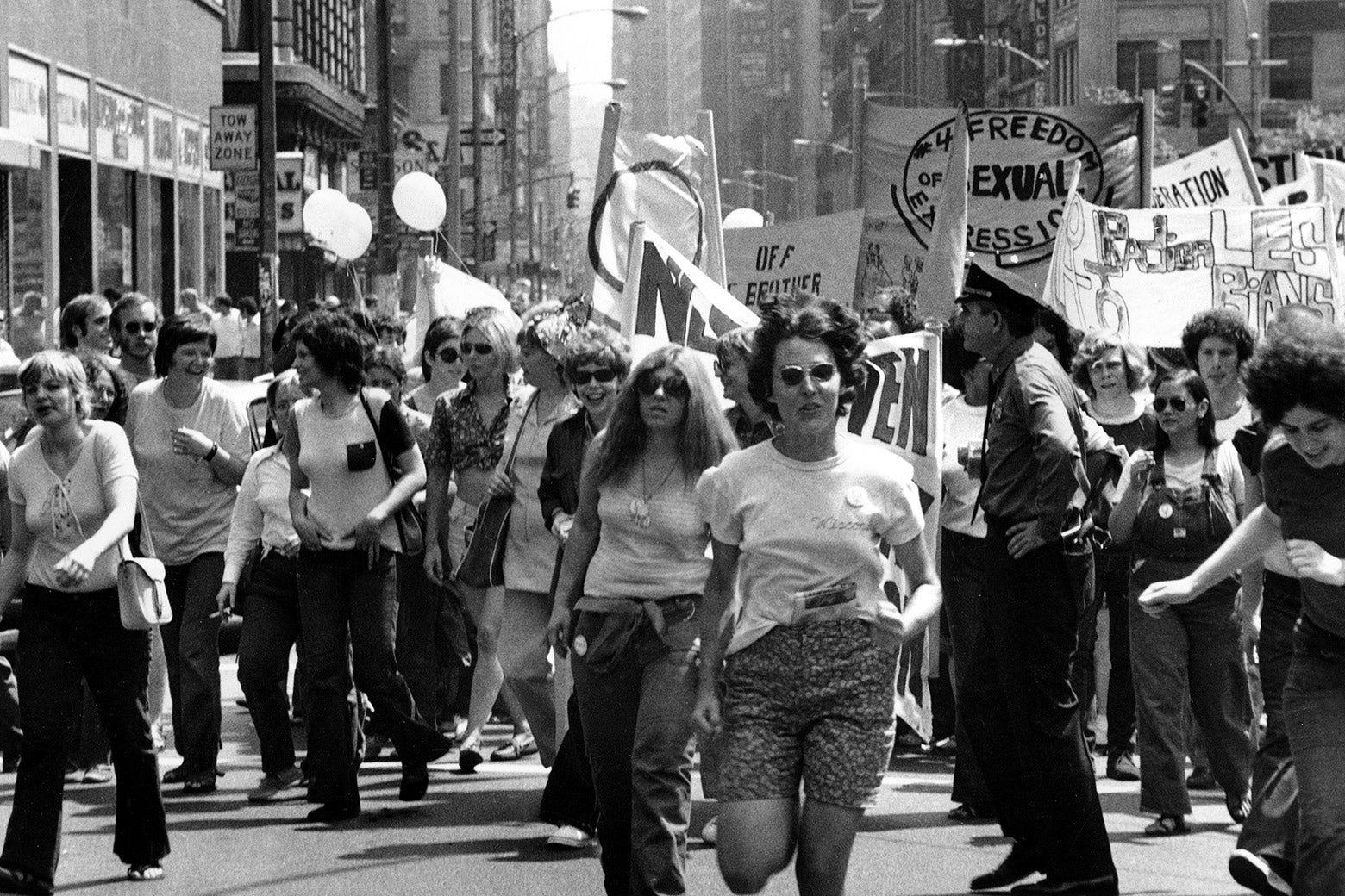 People march on the street for a gay liberation parade.