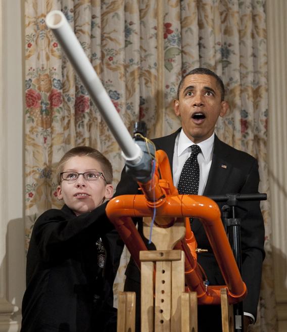 President Barack Obama reacts as 14-year-old Joey Hudy of Phoenix launches a marshmallow from Hudy's "Extreme Marshmallow Cannon" during a tour of the White House Science Fair