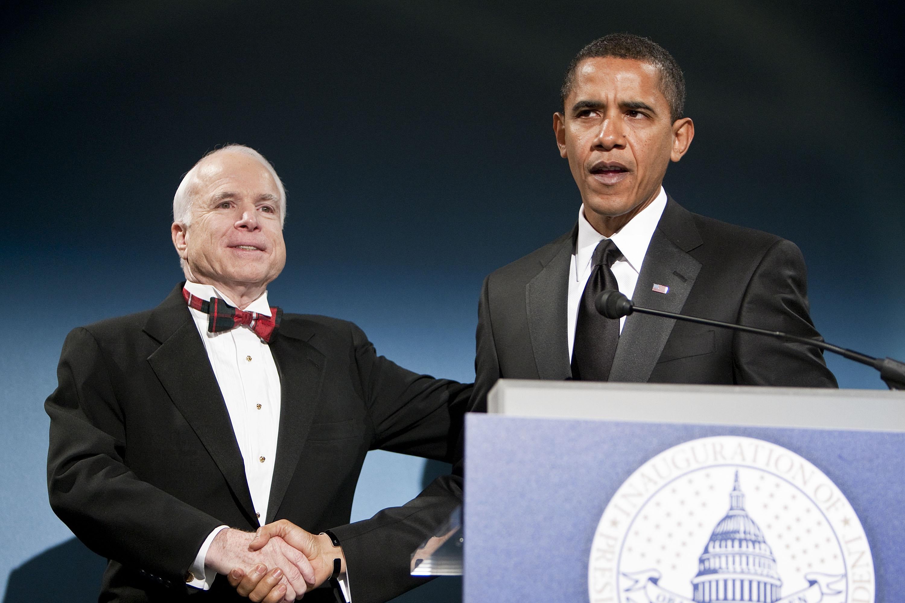 John McCain and Barack Obama share a handshake