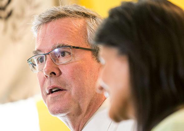 Jeb Bush answers a question as South Carolina Gov. Nikki Haley looks on during a stop in Columbia, South Carolina, on March 17, 2015.