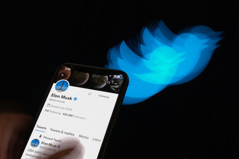 This illustration photo taken on July 8, 2022 shows Elon Musk's Twitter page displayed on the screen of a smartphone with Twitter logo in the background in Los Angeles. - Elon Musk pulled the plug on his deal to buy Twitter on July 8, 2022, accusing the company of "misleading" statements about the number of fake accounts, a regulatory filing showed. (Photo by Chris DELMAS / AFP) (Photo by CHRIS DELMAS/AFP via Getty Images)