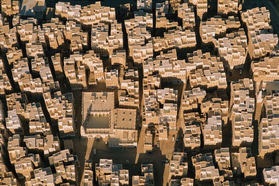 Shibam, Yemen. This ancient trading capital of the Empty Quarter is composed of seven-story mud-and-palm-wood towerhomes built close together to keep the streets and exterior walls cool and shaded for most of the day.