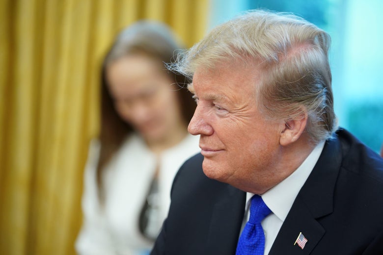 President Donald Trump listens during a meeting with Chinese Vice Premier Liu He in the Oval Office of the White House in Washington, DC, on February 22, 2019. 