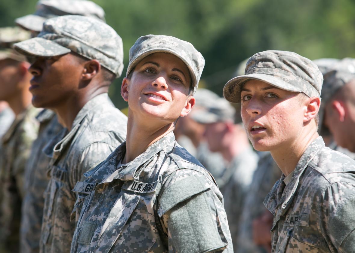 Capt. Kristen Griest (left) and 1st Lt. Shaye Haver look on during the graduation ceremony of the United States Army’s Ranger School on Aug. 21, 2015, at Fort Benning, Georgia.