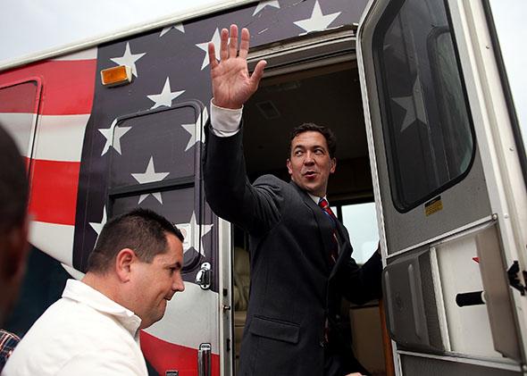 Chris McDaniel waves as he gets on his campaign bus after a rally on June 23, 2014, in Flowood, Mississippi.