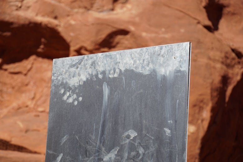 Fingerprint smudges at the top of the monolith