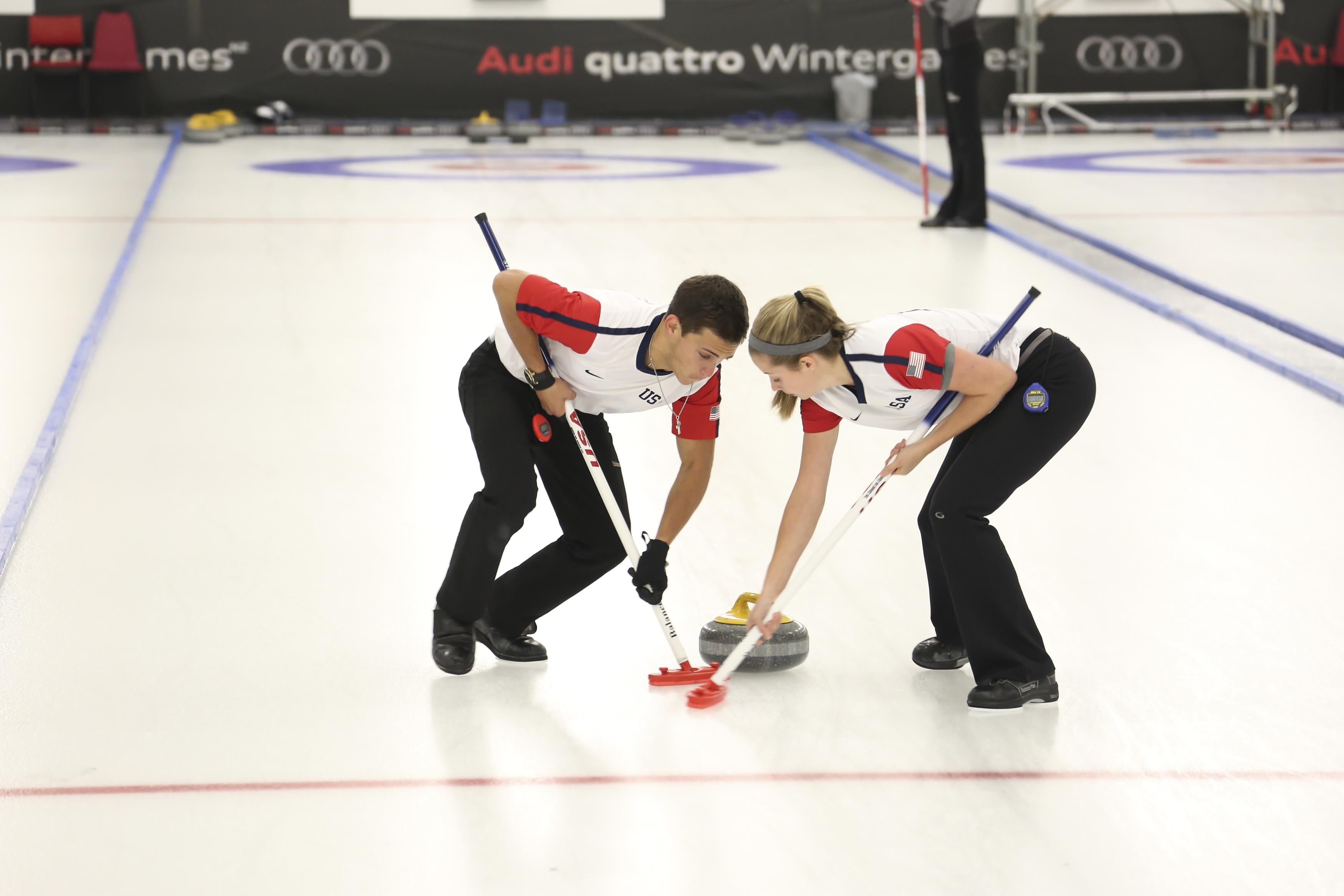 NASEBY, NEW ZEALAND - AUGUST 27:  Sarah Anderson & Korey Dropkin of USA working hard on their brooms in the Curling Mixed Doubles Finals during the Winter Games NZ at Naseby Curling Rink on August 27, 2015 in Naseby, New Zealand.  (Photo by Neil Kerr/Getty Images)