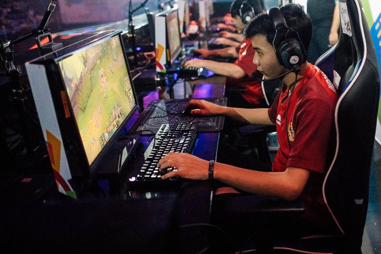The Indonesian team competes in the eSports Round 6 Match 1 as an exhibition sport at the 2018 Asian Games in Jakarta on Tuesday.