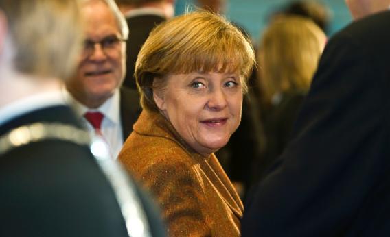 German Chancellor Angela Merkel arrives to greet participants at the start of a summit on the integration of foreigners in Germany, at the Chancellery on Jan. 31, 2012, in Berlin.
