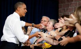 President Obama shakes hands with supporters as he arrives to address a campaign event at Truckee Meadows Community College in Reno, Nev., on Aug. 21, 2012