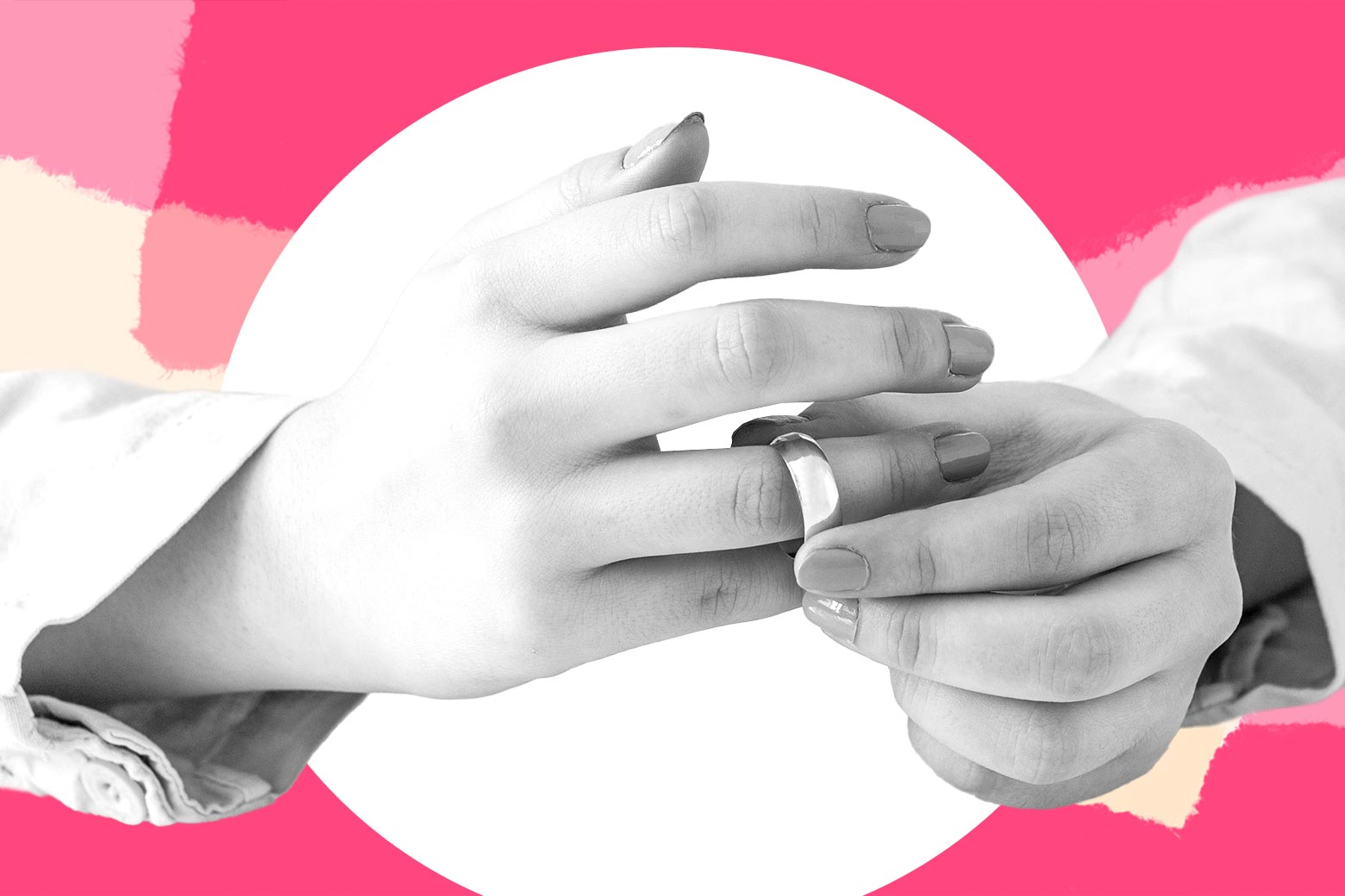 A woman taking a wedding ring off.