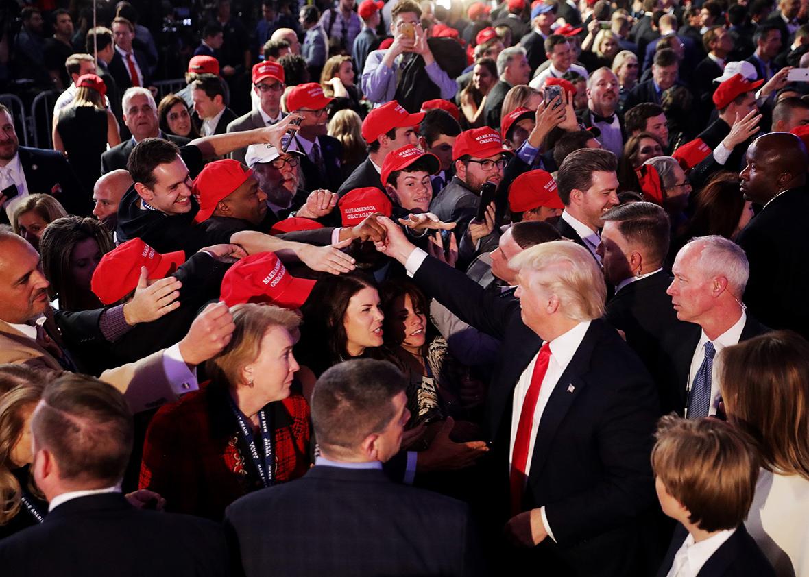 Republican president-elect Donald Trump gives greets people in the crowd after delivering his acceptance speech at the New York Hilton Midtown in the early morning hours of November 9, 2016 in New York City. 